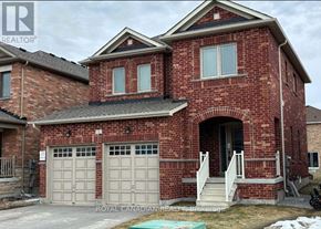 Brock (Beaverton) apartment for rent - A red brick house with a white garage door and a small porch.