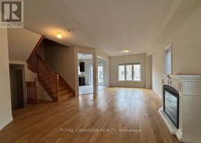 Brock (Beaverton) apartment for rent - A spacious living room with hardwood floors and a fireplace.