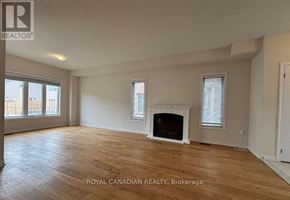 Brock (Beaverton) apartment for rent - A spacious room with a fireplace and wooden flooring.