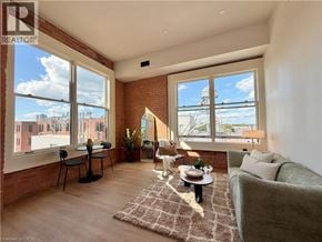 Hamilton apartment for rent - A living room with a couch, chairs, and a table with a plant on it.
