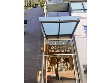 Richmond apartment for rent - The entrance to a building with a glass door and a sign that reads "QUINTET 7988 Ackroyd Road".