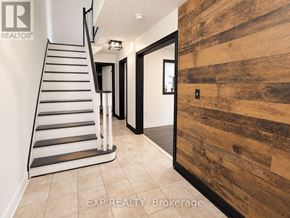 Brampton (Brampton North) townhouse for rent - A wooden wall in a hallway with a staircase on the left side.