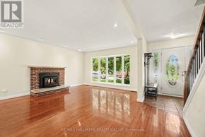 Ottawa apartment for rent - A spacious living room with a fireplace and hardwood floors.