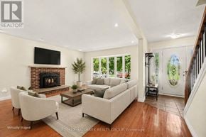 Ottawa apartment for rent - A living room with a fireplace and a television.