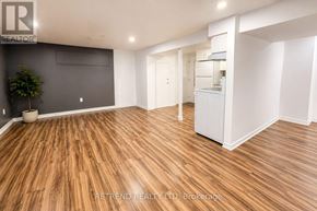 Toronto (Tam O'shanter-Sullivan) apartment for rent - A room with wooden flooring and white walls.