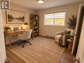 St. John's multi-family for rent - A room with a desk, chair, and a painting on the wall.