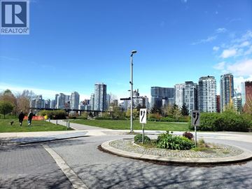 Vancouver townhouse for rent - A city park with a circular walkway and a signpost.