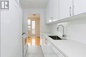 Toronto (Thorncliffe Park) condo for rent - A kitchen with white cabinets and a sink.