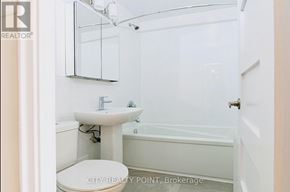 Toronto (Thorncliffe Park) condo for rent - A white bathroom with a sink, toilet and bathtub.
