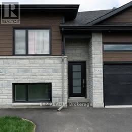 The Nation apartment for rent - A house with a brown roof and a sign that says REALTOR.