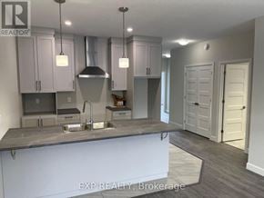 The Nation apartment for rent - A kitchen with a sink and cabinets.