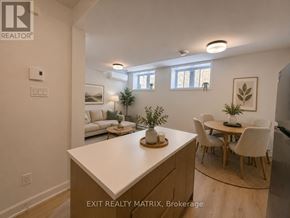 Russell apartment for rent - A kitchen with a table and chairs in the middle of the room.
