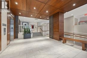 Oshawa (O'neill) condo for rent - A lobby area with a bench and a plant.