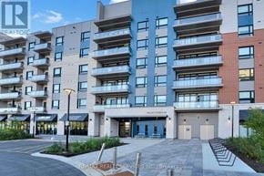 Ottawa condo for rent - A modern apartment building with a parking lot in front.