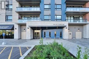 Ottawa condo for rent - The front of a building with the sign 339-397 CODD'S RD on it.