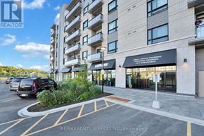 Ottawa condo for rent - A building with a sign that says RE/MAX REALTY SERVICES INC. Brokerage.