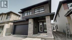 Ottawa apartment for rent - A modern house with a garage is for sale.