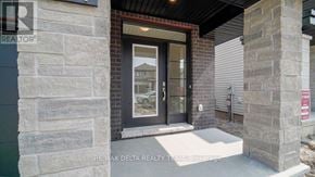 Ottawa apartment for rent - The entrance to a building with a glass door and a stone pillar.