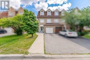 Mississauga (Churchill Meadows) apartment for rent - A house with a white car parked in front.