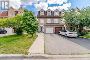 Mississauga (Churchill Meadows) apartment for rent - A white car is parked in front of a house with a garage.