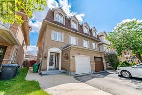 Mississauga (Churchill Meadows) apartment for rent - A house with a white car parked in front.