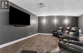 Niagara Falls (Oldfield) condo for rent - A home theater room with a large screen and comfortable seating.