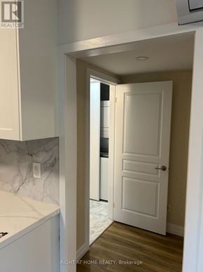 Toronto (Annex) apartment for rent - A white door is in a hallway with a marble counter top.