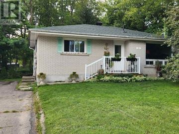 Midland apartment for rent - A house with a white porch and green shutters is for sale.