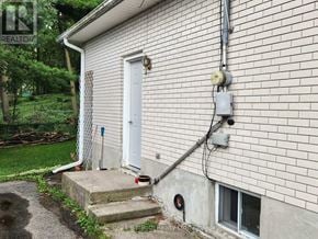 Midland apartment for rent - A house with a white door and a small window on the side.