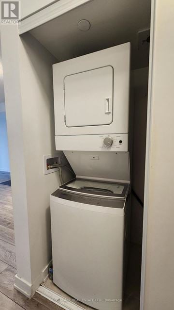 Burlington (Alton) condo for rent - A white dishwasher is built into a kitchen cabinet.