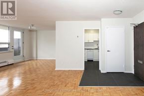 Toronto (Westminster-Branson) house for rent - A room with a wooden floor and white walls.