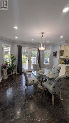 Vaughan (East Woodbridge) apartment for rent - A well-lit dining room with a glass table and chairs.