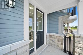 Loyalist (Bath) apartment for rent - A blue house with a black door and a stone wall.