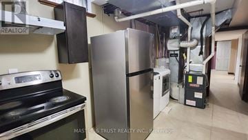 Richmond Hill (Westbrook) apartment for rent - A kitchen with a stove and a refrigerator.