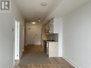 Toronto (Don Valley Village) condo for rent - A kitchen area with white cabinets and a countertop.