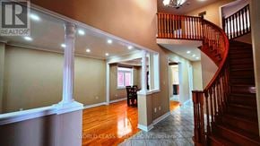 Vaughan (Vellore Village) apartment for rent - A spacious home interior with a staircase and a dog.
