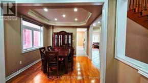 Vaughan (Vellore Village) apartment for rent - A dining room with a wooden table and chairs.