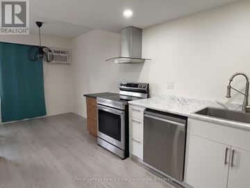 Toronto (Islington-City Centre West) condo for rent - A kitchen with white cabinets and stainless steel appliances.