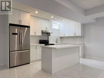 Vaughan (Vellore Village) apartment for rent - A modern kitchen with white cabinets and a stainless steel refrigerator.