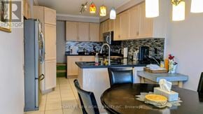 Vaughan (Sonoma Heights) apartment for rent - A kitchen with a refrigerator, table, and chairs.