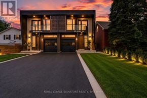 Mississauga (Lakeview) apartment for rent - A modern house with a large front yard and a driveway leading to the garage.