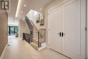 Mississauga (Lakeview) apartment for rent - A spacious hallway with a staircase and white walls.