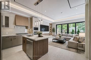 Mississauga (Lakeview) apartment for rent - A modern kitchen with a central island and a view of the backyard.