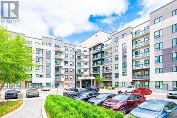 Milton (Fo Ford) condo for rent - A large apartment complex with a parking lot in front.
