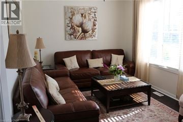 Cambridge apartment for rent - A living room with a brown leather couch and a coffee table.