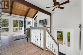 Oro-Medonte (Horseshoe Valley) apartment for rent - A white door is on the right side of a staircase.