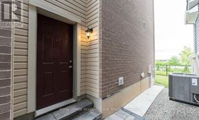 Milton (Cb Cobban) apartment for rent - A brown door is on the side of a house.