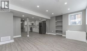 Milton (Cb Cobban) apartment for rent - A spacious room with a kitchen area and a dining area.