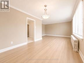 Toronto (Beechborough-Greenbrook) multi-family for rent - A room with wooden flooring and a chandelier hanging from the ceiling.