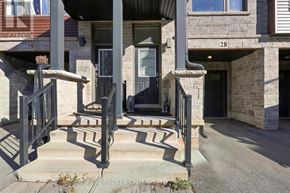 Hamilton (Parkview) townhouse for rent - A house numbered 28 with a front porch and steps.
